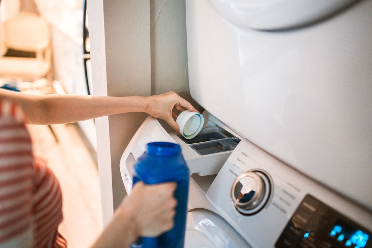 Measuring liquid detergent into a front-loading washing machine dispenser